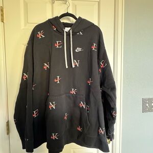 Nike Men's Black Hoodie with Orange and Grey Logo Pattern